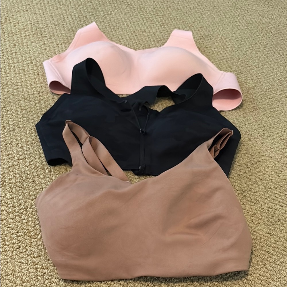 THREE lululemon athletica Women's Sports Bras- Black, Pink, Tan. 36D.